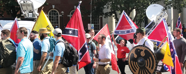 CHAOS AND HATE: Alt-right protesters carrying Nazi, Confederate and medieval symbols at the 2017 Charlottesville, Virginia, rally.